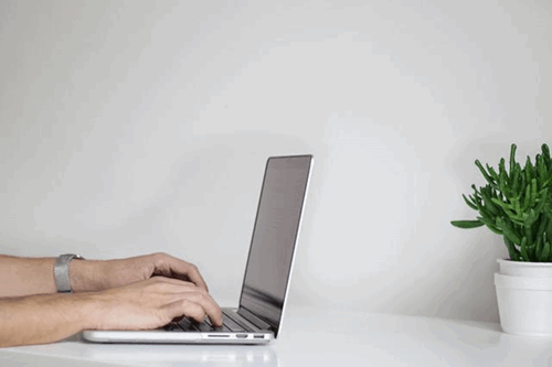 An employee working from home with their laptop.