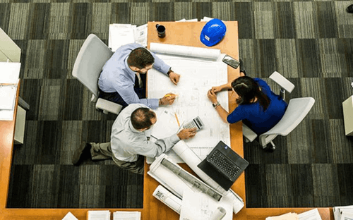 A group of employees having a meeting.