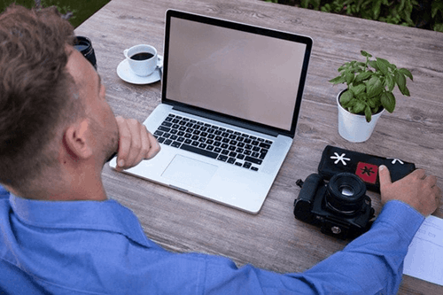 Someone using a laptop.