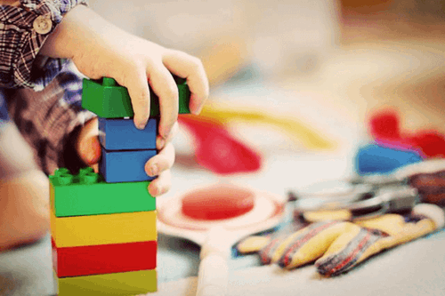 A child playing with building blocks.