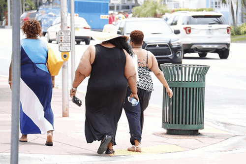 Three people walking.