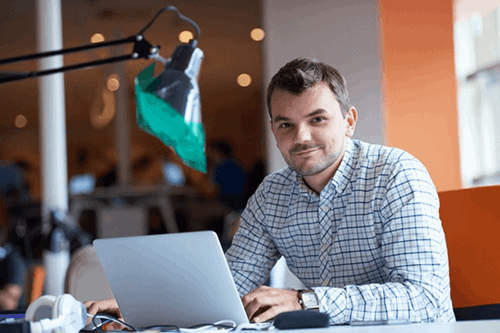 A person working on a laptop.