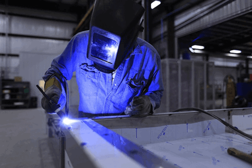 Man using a grinder.