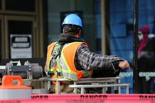 worker in hi-vis on a cherry picker