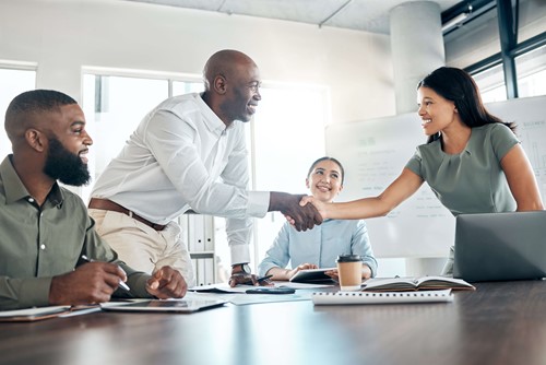 an employee welcoming a new team membe