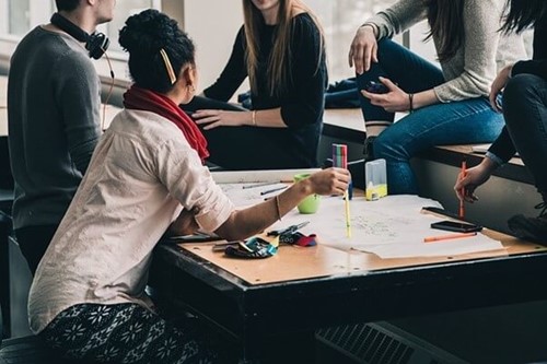 a group of employees discussing work issues