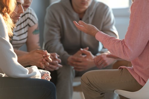 A group of employees discussing bullying