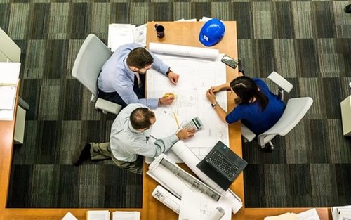 Three people having a meeting on time