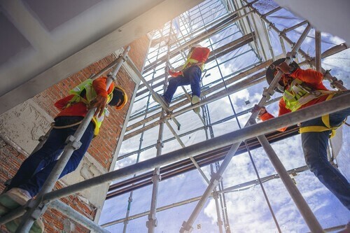 construction workers on scaffolding