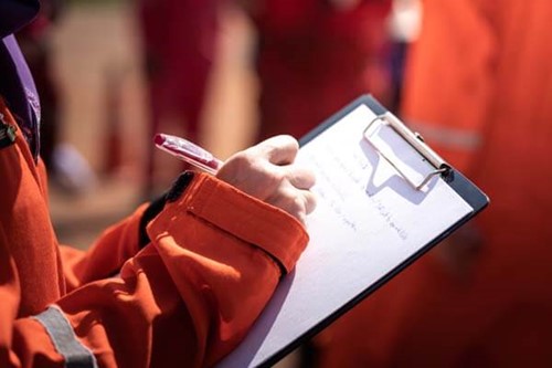 A safety worker noting an accident