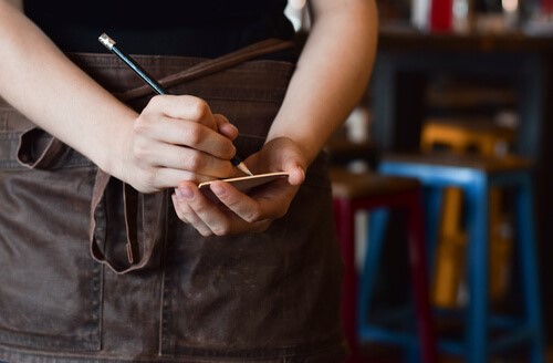 Waitstaff taking notes