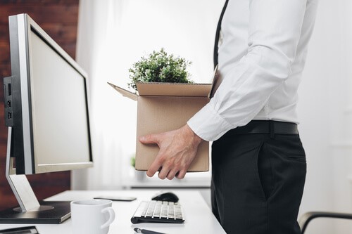 An employee moving into their new desk